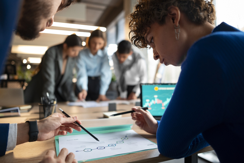 People at an office discussing franchise growth strategies